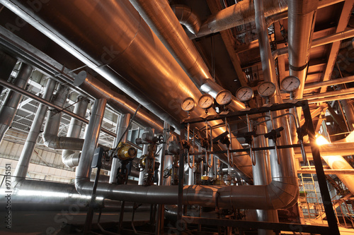 Equipment, cables and piping as found inside of a modern industr © Andrei Merkulov