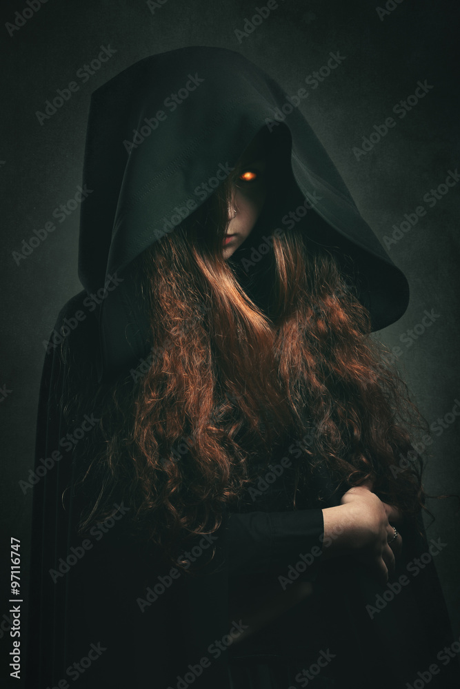 Fire witch with black robe Stock Photo