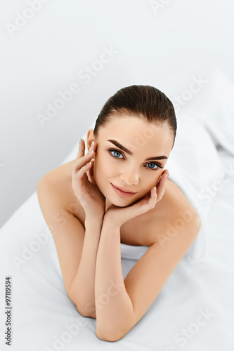 Beauty Portrait. Beautiful Young Model Woman's Touching Her Face. Perfect Fresh Pure Skin. Spa Body And Skin Care, Cleansing And Moisturizing Concept. Healthy Lifestyle