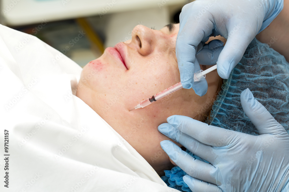 Naklejka premium Cosmetic treatment with injection in a clinic