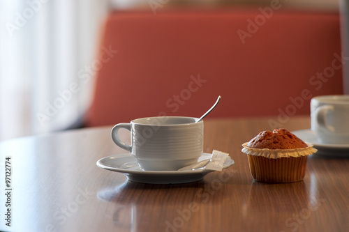 cup of tea and cake on the table