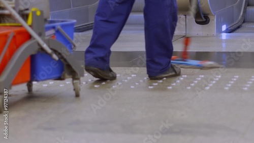 Cleaning floor in underground station.