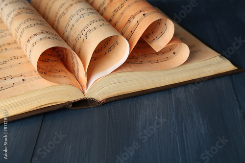 Book pages curved into hear...