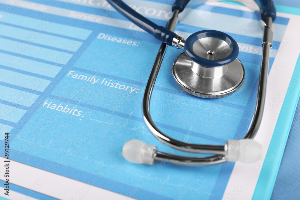 Medical stethoscope and clipboard on blue background Medical stethoscope and clipboard on blue background