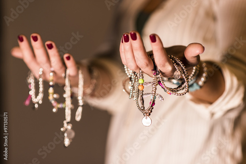 woman with bracelets and cool light photo