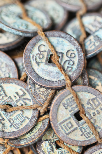 Tied antique Chinese coins on Panjiayuan Market, located in south east Beijing, China.