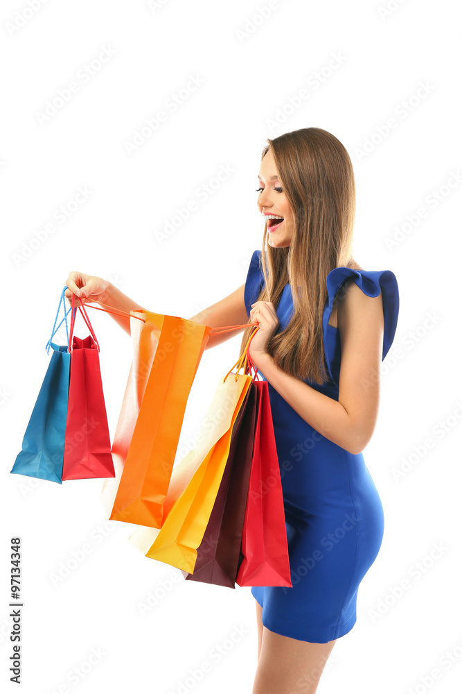 Young pretty woman with shopping packages isolated on white Young pretty woman with shopping packages isolated on white