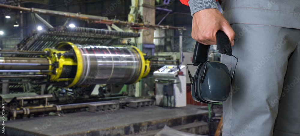 Worker with protective headphone Worker with protective headphone