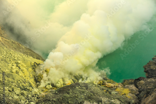 Kawah Ijen volcanic crater lake and toxic sulfur fume,Indonesia Fototapeta