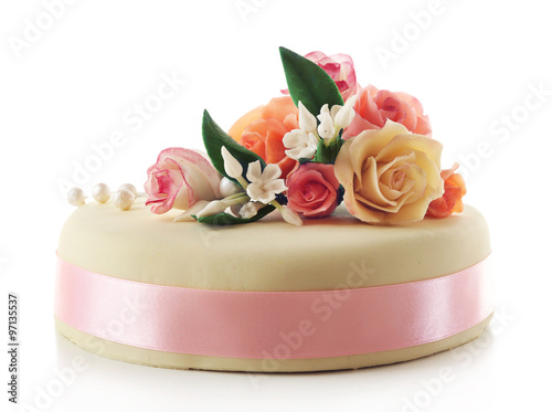 Cake with sugar paste flowers, isolated on white