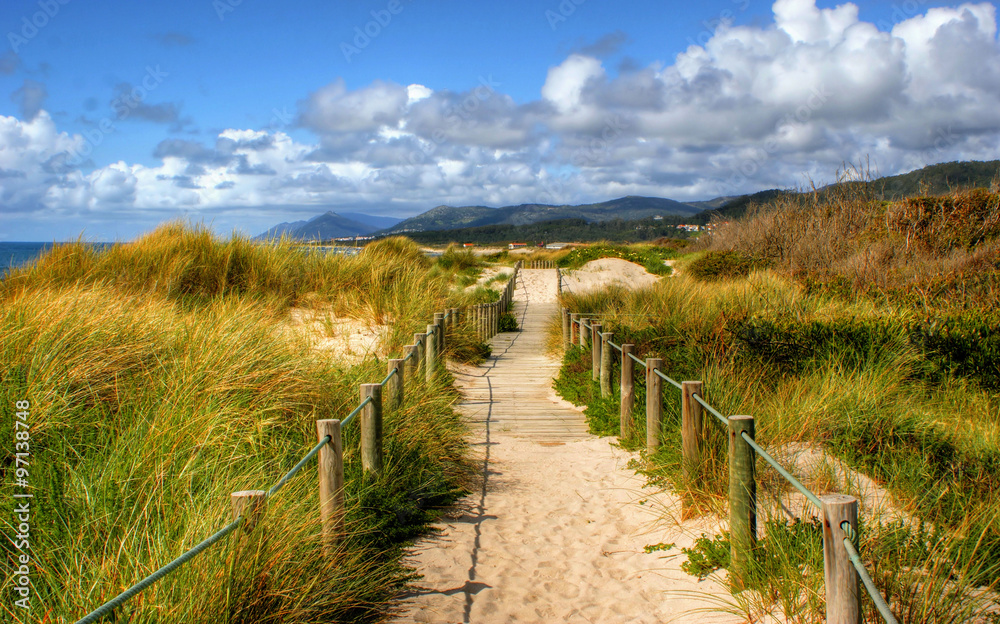 Boardwalk through the sand dunes on beach in Portugal