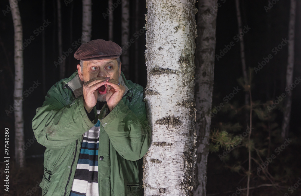 Howl of despair - senior man calling for help lost in a forest Howl of despair - senior man calling for help lost in a forest