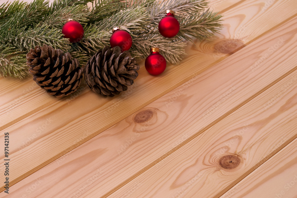 Christmas fir tree branch with decorations and pine cones Christmas fir tree branch with decorations and pine cones