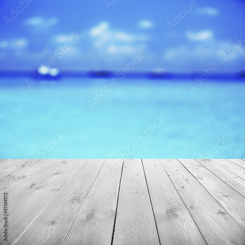 Wooden pier with beautiful sea or ocean background