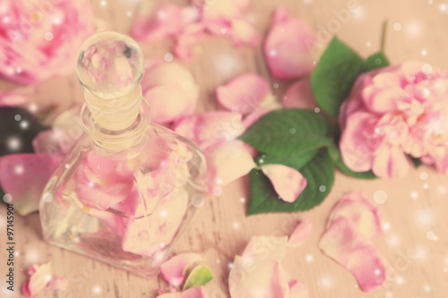 Fototapeta Naklejka Na Ścianę i Meble -  Rose oil in bottle on light background