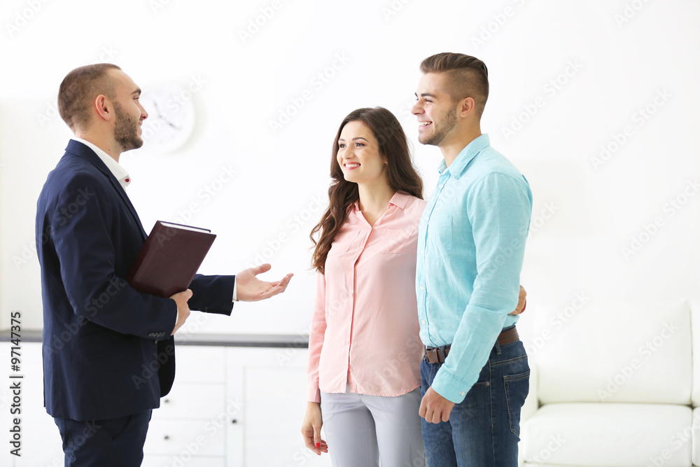 Happy family with estate agent, on light background Happy family with estate agent, on light background