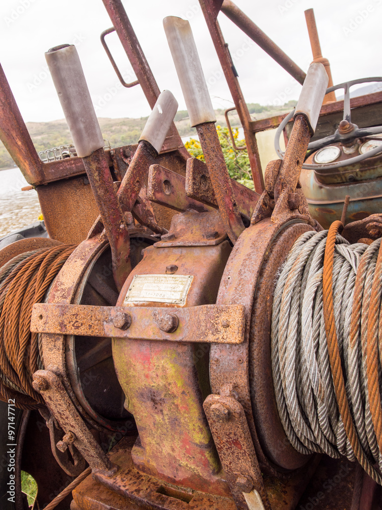 Salen Pier, Isle of Mull, Scotland. 22nd May 2015. Winding mechanism, the old derelict tractor. Salen Pier, Isle of Mull, Scotland. 22nd May 2015. Winding mechanism, the old derelict tractor.