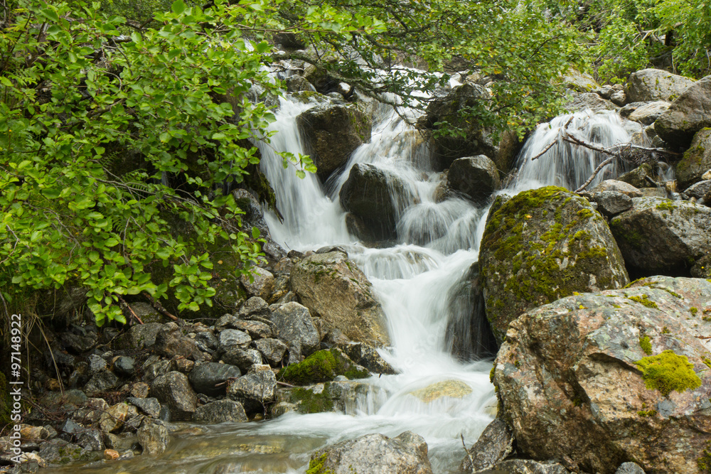 small waterfall of a stream small waterfall of a stream