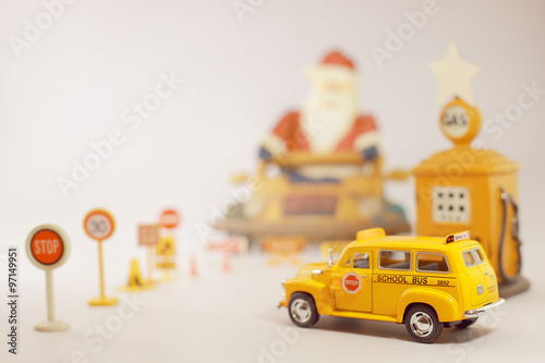 Yellow school bus toy model in Christmas theme.Selective focus a