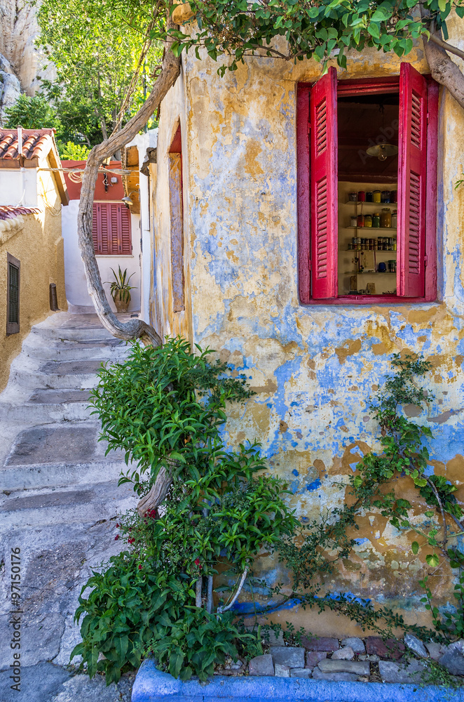 Fototapeta premium Street with old buildings in Plaka neighborhood, Athens, Greece