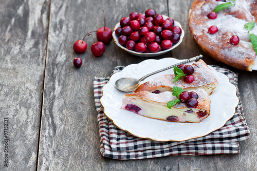 pieces of cranberry cheesecake tart on a wooden table
