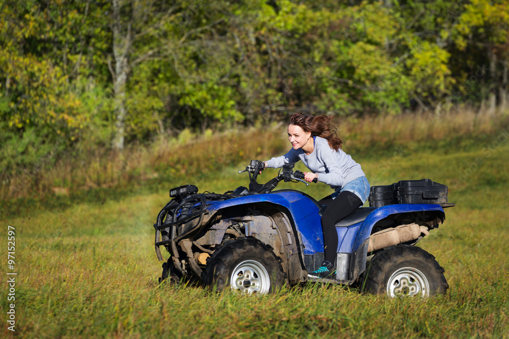 Elegant woman riding extreme quadrocycle ATV Elegant woman riding extreme quadrocycle ATV