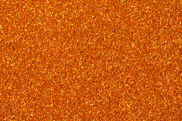 Orange glitter sparkle. Background for your design.