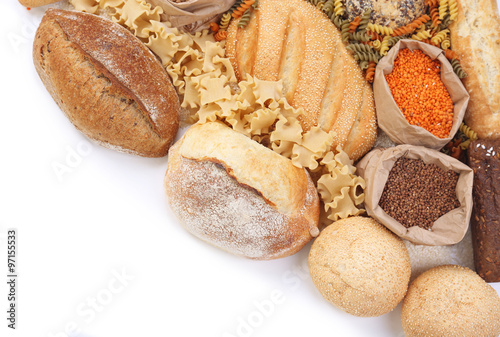 Composition of mixed breads, macaroni and grains on white background