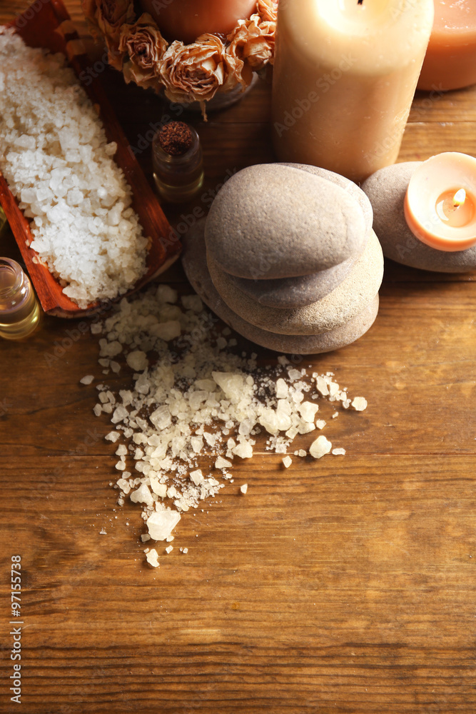 Beautiful relax composition with candles and pebbles on wooden background, close up Beautiful relax composition with candles and pebbles on wooden background, close up