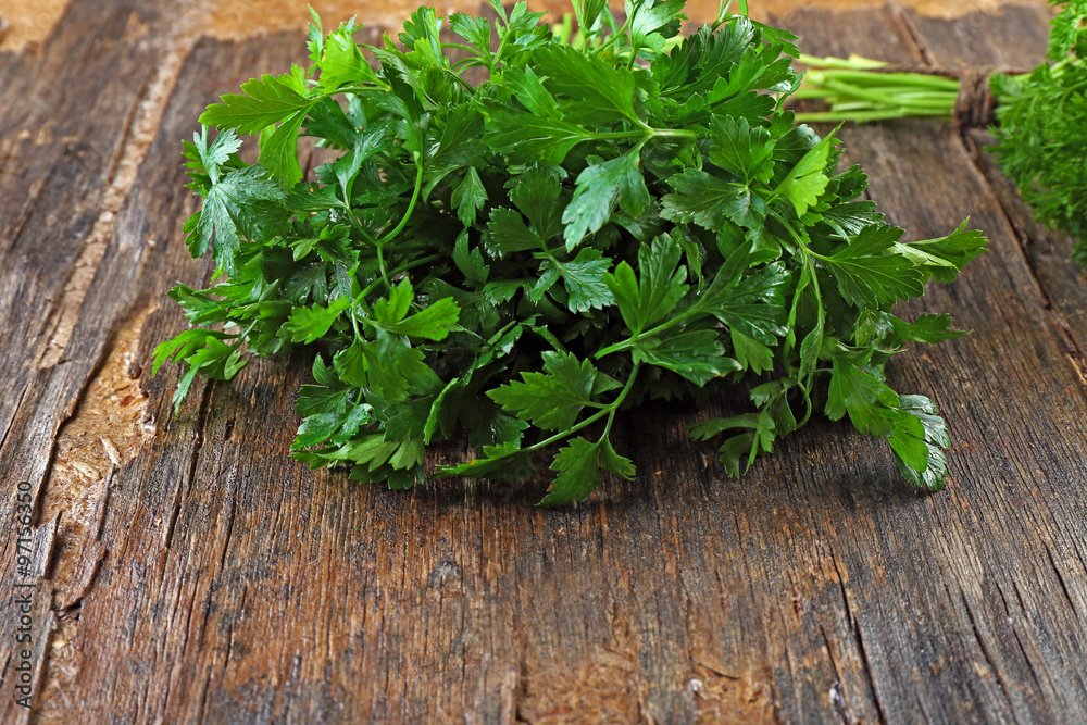 Fresh parsley on wooden background Fresh parsley on wooden background