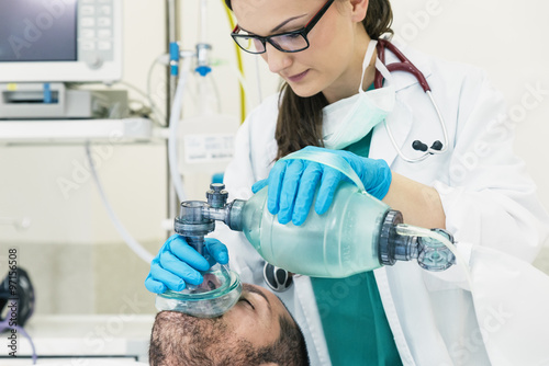 Doctor using the ball resuscitation with a patient photo