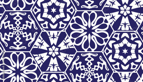 ector seamless background of hexagons decorated with patterns. Snowflakes and hexagons patterns. Blue geometrical seamless background.