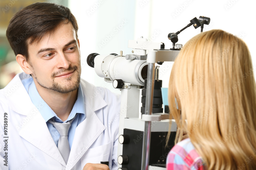 Adult male doctor examing adult female patient Adult male doctor examing adult female patient