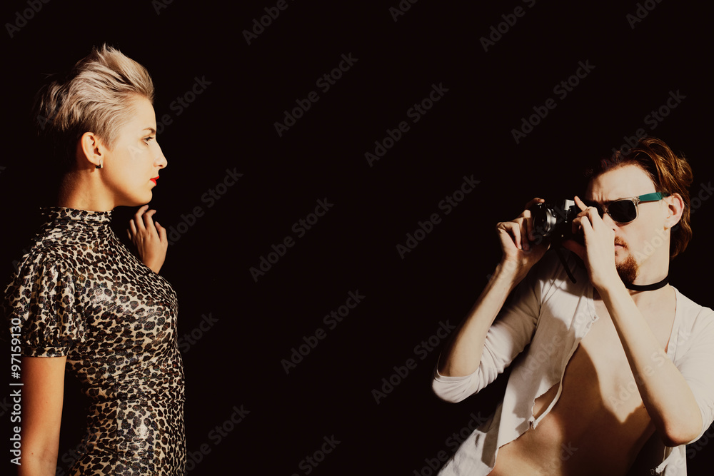 Man photographing a young women Man photographing a young women