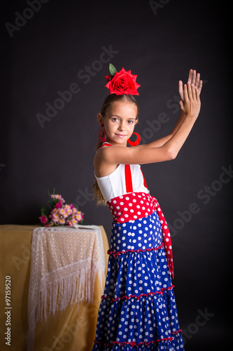 Wallpaper Mural Young girl in flamenco outfit clapping hands Torontodigital.ca