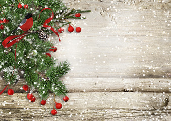 Christmas vintage wooden background with fir branches, bullfinch