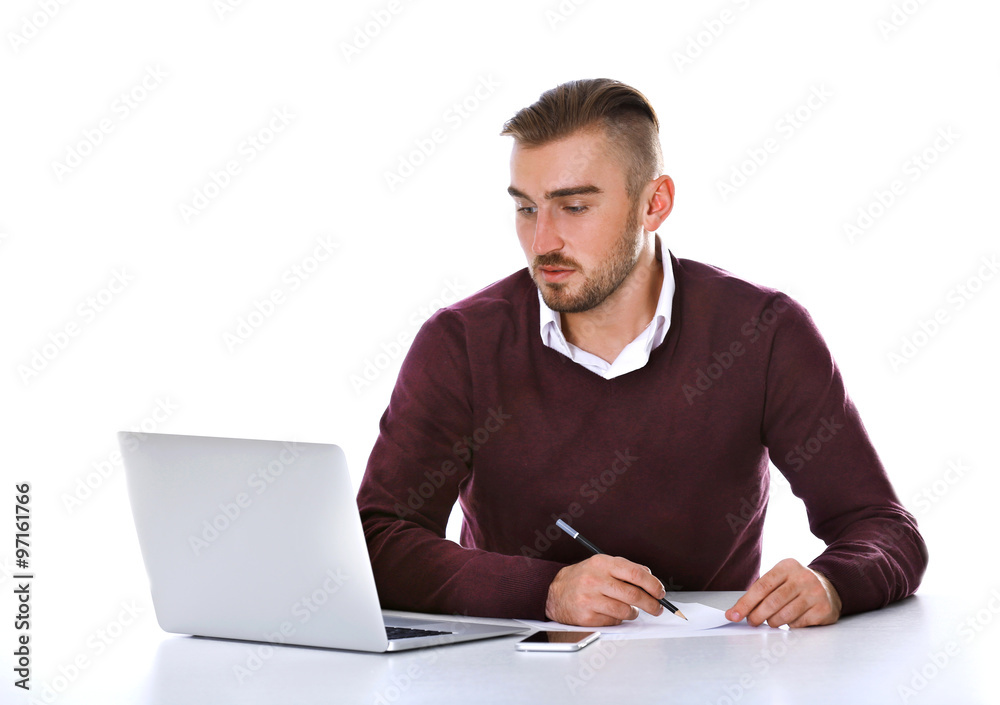 Businessman working with laptop on bright background Businessman working with laptop on bright background