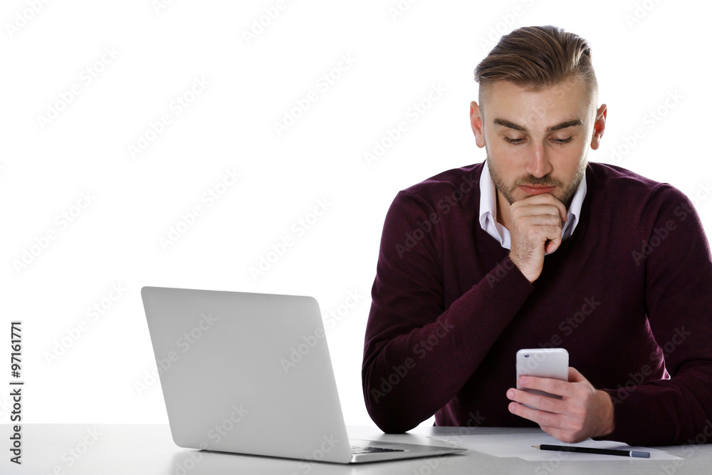 Businessman working with laptop on bright background Businessman working with laptop on bright background