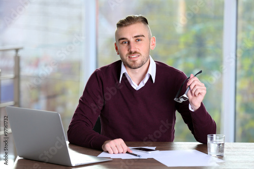 Businessman working with la...