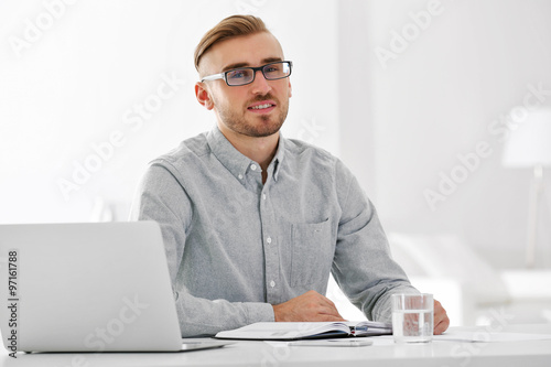 Businessman working with la...