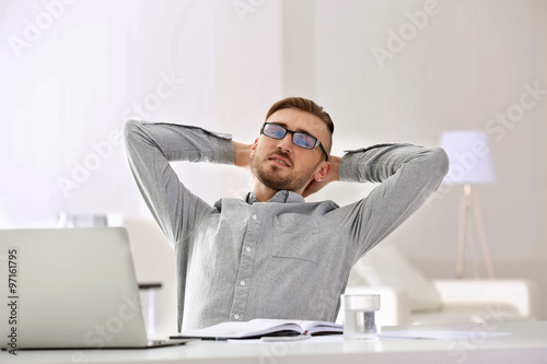 Businessman working with la...