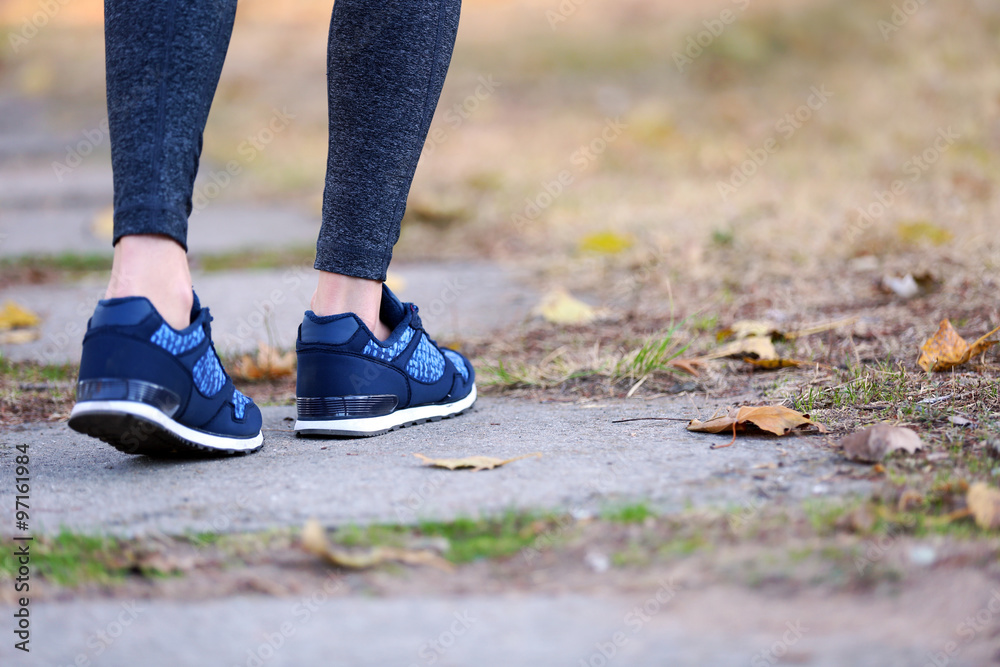 Sports woman legs in running movement