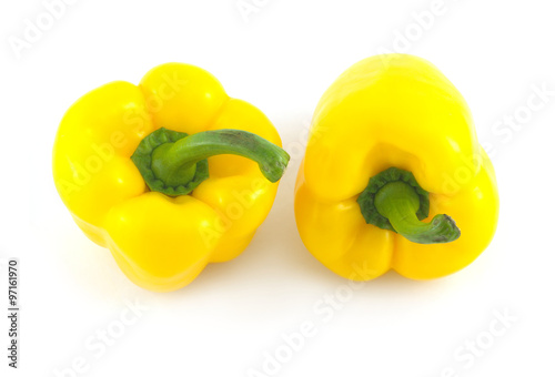 Two big yellow ripe bell peppers isolated on white closeup © DyMaxFoto