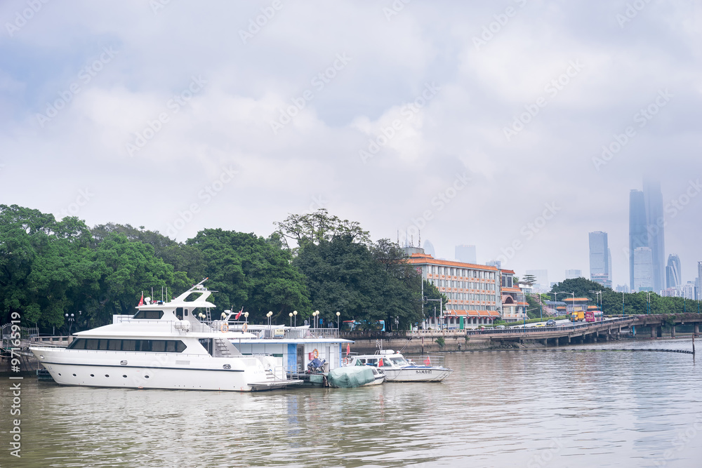 Fototapeta premium GUANGZHOU, CHINA - Oct.7: Day view of buildings by the Pearl River. The modern buildings on both sides of the Pearl River make it a beautiful landscape of the city.