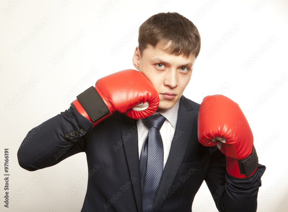 Businessman in red boxing gloves Businessman in red boxing gloves