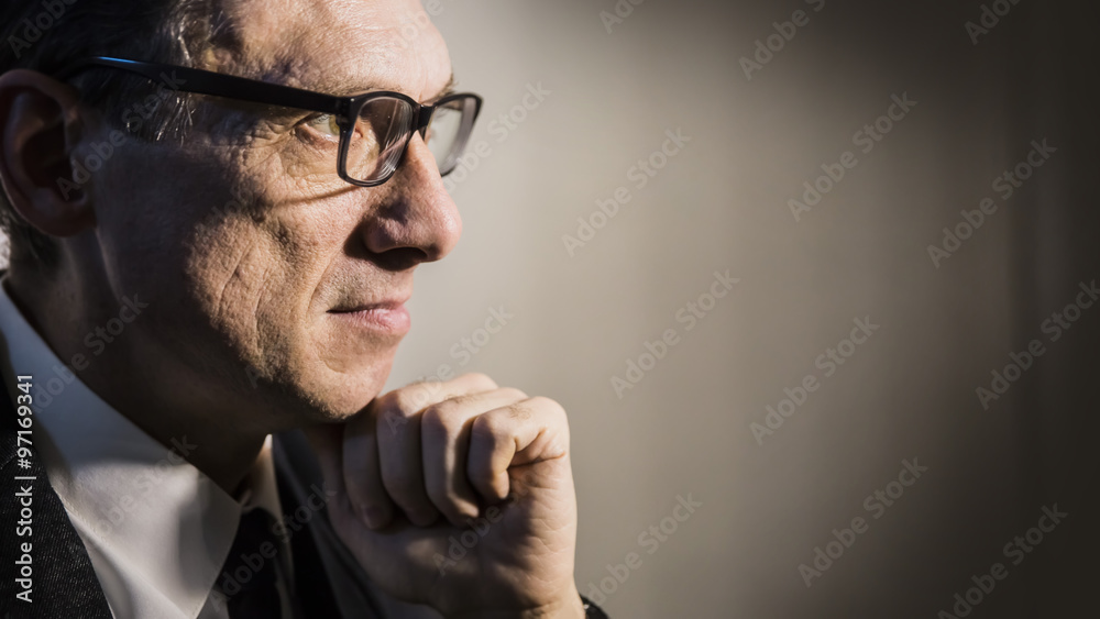 Obraz premium close portrait of an adult man in profile thinking