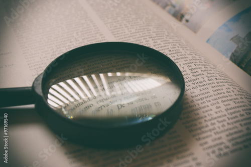 Magnifying glass on a book