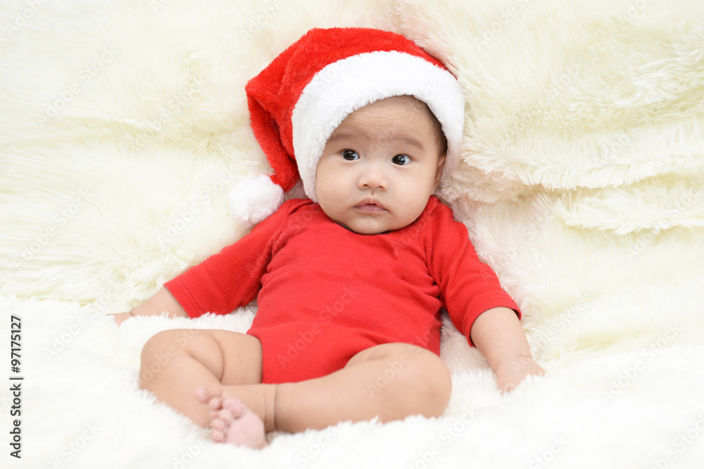 asian cute baby sitting on a soft cloth in the living room. Baby asian cute baby sitting on a soft cloth in the living room. Baby