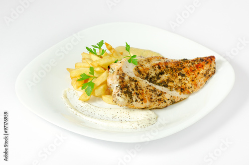 plate with grilled white meat and fries