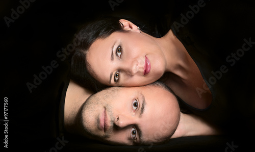 Portrait of couple in love on black background